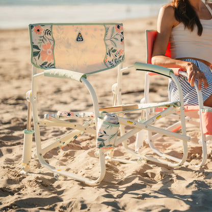 A Grab and Go Rocker floral bouqet on a sandy beach. 
