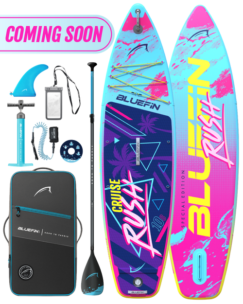 Inflatable paddleboard with colorful design, paddle, fin, pump, and carrying bag for travel.