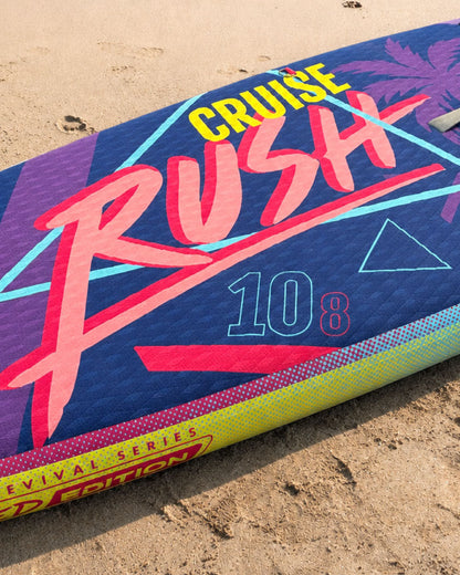 Inflatable paddleboard with colorful graphics, featuring the text 'CRUISE RUSH 10 8' and a textured surface.